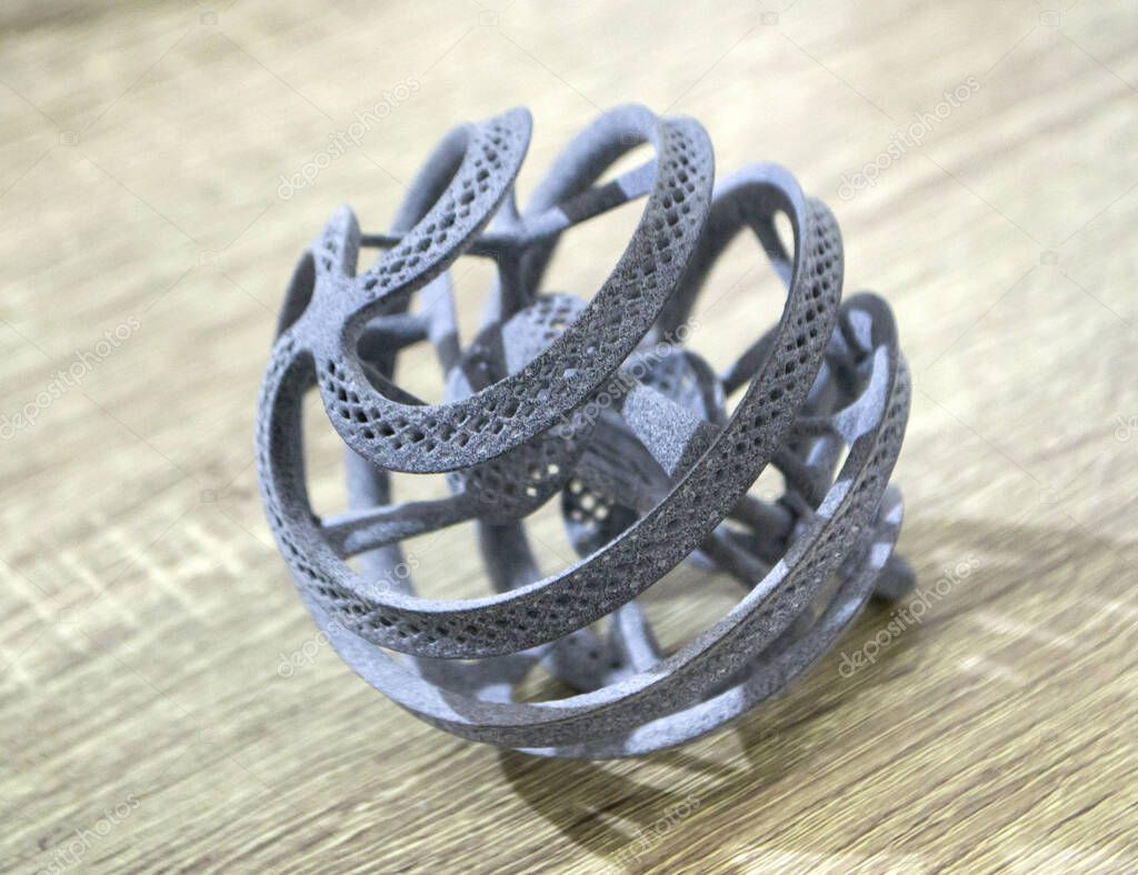 Object printed on powder 3D printer from polyamide powder close-up. Three-dimensional model from thermoplastic gray color. Rapid prototyping, printing products. Progressive modern additive technology
