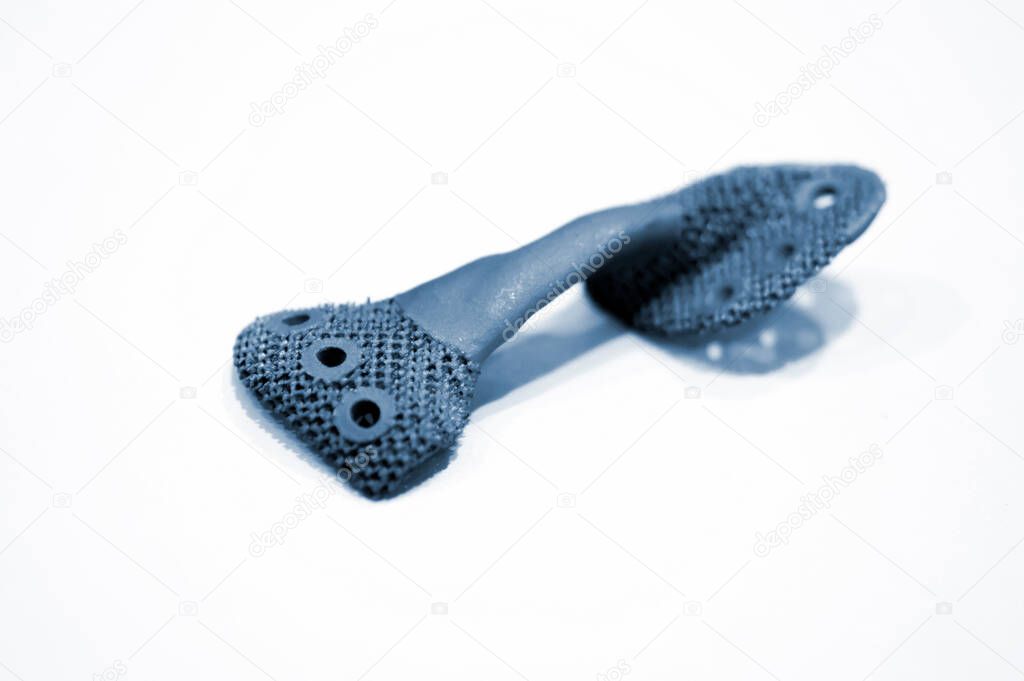 Object printed on metal 3d printer isolated on white background close-up.