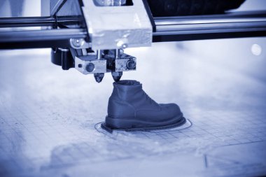 3D yazıcı erimiş plastik mavi yakın çekim formunu yazdırır.