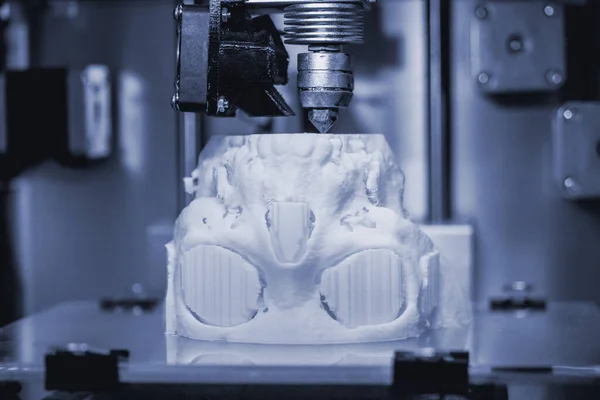 3D printer prints the form of molten plastic white.