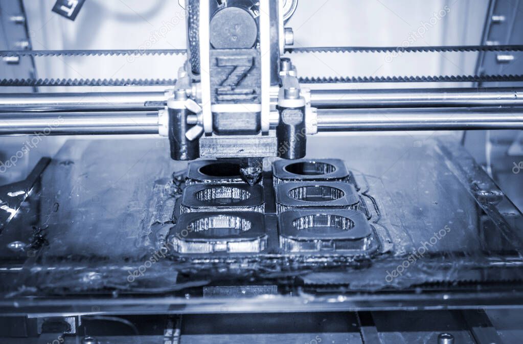 Modern 3D printer printing figure close-up. Automatic three dimensional