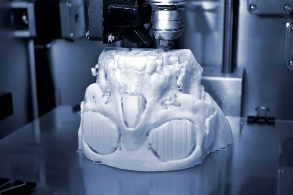 3D printer prints the form of molten plastic white.