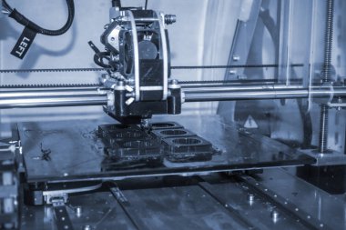 Modern 3D yazıcı yazıcı figürü yakın plan. Otomatik olarak üç boyutlu