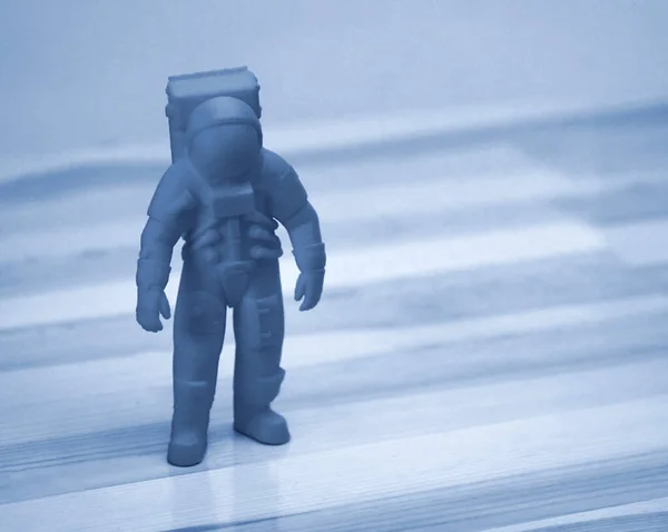 Model printed on 3d printer close-up. Cosmonaut of blue color.