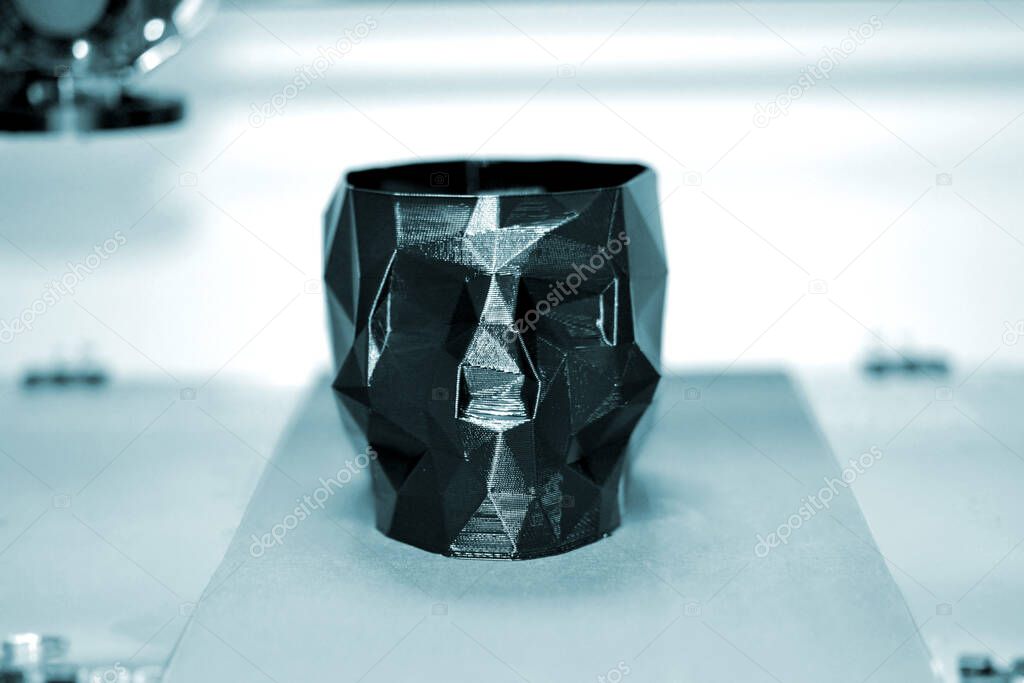 Abstract object of a black color printed by 3d printer.