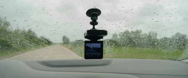 video camera recorder inside car driving rainy day