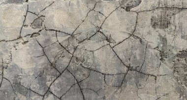 Sert yüzeyli çatlamış beton duvar dokusu