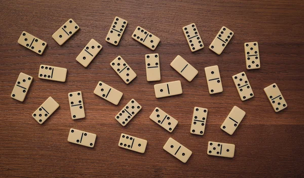 Dominoes on a wooden table — Stock Photo, Image