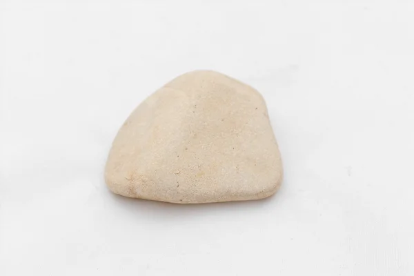 Ein grauer Stein isoliert auf weiß — Stockfoto