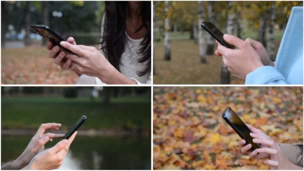 Vrouwelijke handen met een telefoon in hun handen buiten — Stockvideo