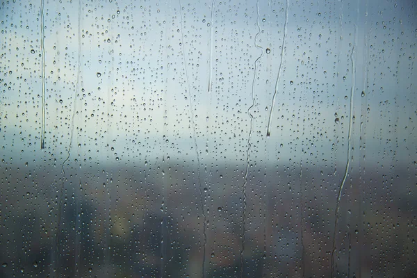 Art pattern of water drop on tower window after rain, for background. — Stock Photo, Image