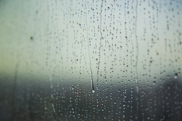 Art pattern of water drop on tower window after rain, for background. — Stock Photo, Image