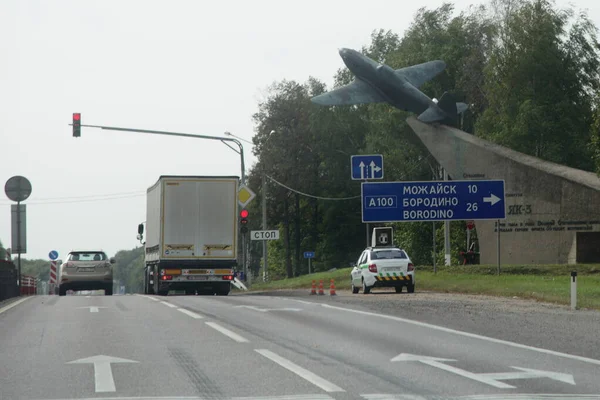 Moscow Region, Russia 09 04 2020: Speed control car with speedcam on roof on roadside on Borodino crossroads near monument to the airplane in Moscow area at summer day — Stock Image Moscow Region Russia 2020 Speed Control Car Speedcam Roof Roadside Stock Image