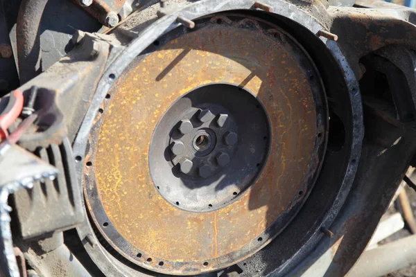 Old rusty truck motor flywheel closeup, clutch disk change lorry repair service