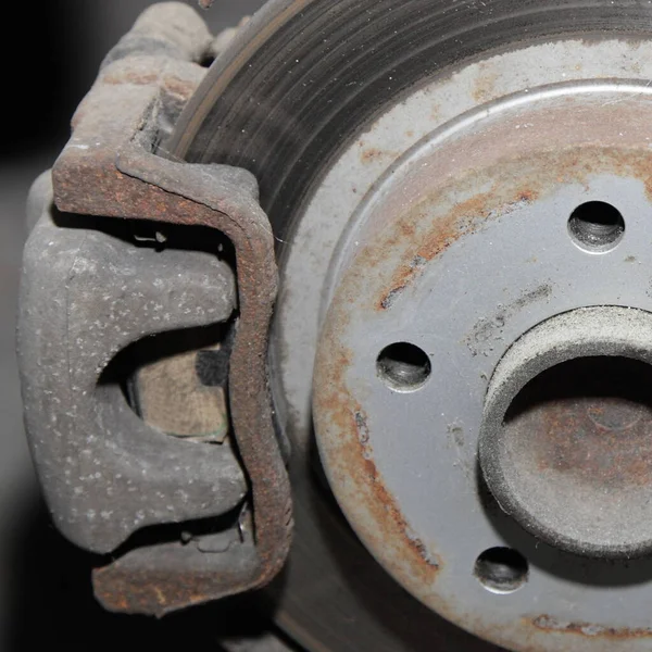 One cylinder brake caliper with brake pads on unventilated brake disk , Car brake system close up part
