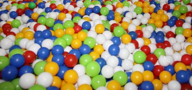 Çocuk partisi, oyuncaklar bir sürü renkli plastik toplar: kırmızı, yeşil, mavi, sarı, geniş arkaplan dokusu