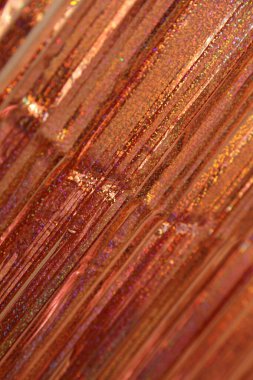 Parlak bronz renkli köşegen çizgiler perspektif olarak yakın, şenlik arka planı için dikey çerçeve dokusu