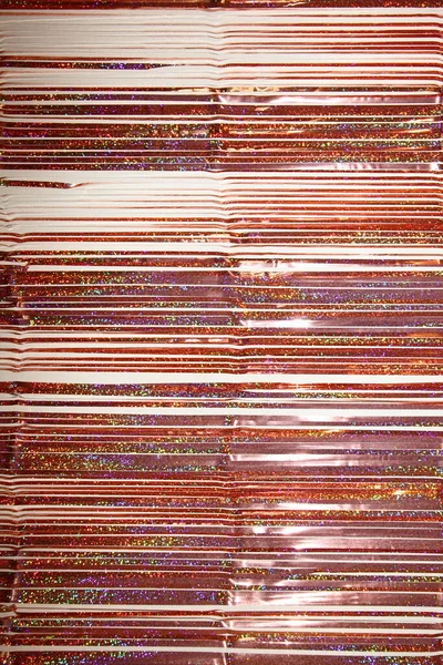 Bronze Brilhante Colorido Ouropel Linhas Horizontais Sobre Mesa Imagem Vertical — Fotografia de Stock