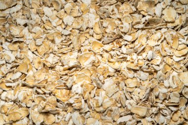 Yuvarlak yulaf ezmesi arka planında kahvaltıda sağlıklı beslendiği biliniyor.