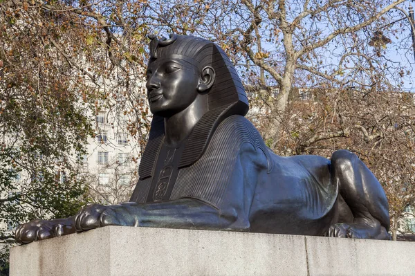 One of two Sphinx guarding Cleopatra\'s Needle on Victoria Embankment in London England UK erected in 1878 and is a popular tourist travel destination attraction landmark, stock photo image