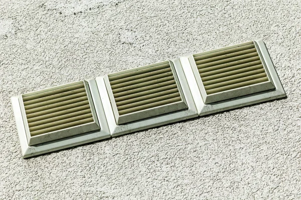 Heating and cooling air vent  on the exterior wall of a house for a good airflow ventilation, stock photo image