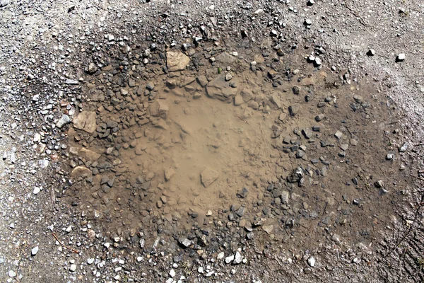 Pothole em uma superfície de estrada — Fotografia de Stock