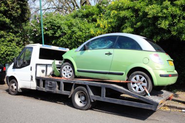 Crashed car on a transport truck