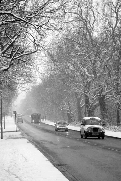 Snow blizzard during rush hour traffic — ストック写真