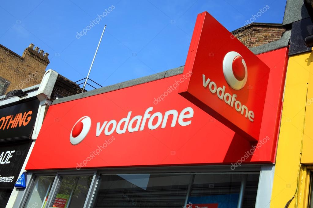 London, United Kingdom, Apr 17, 2011 : Vodafone logo advertising sign on one of its branch retail outlets in Notting Hill