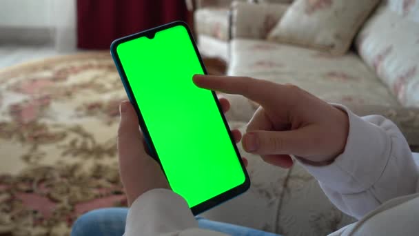 Teenager Looks Information Smartphone Screen Green Background — Stock Video