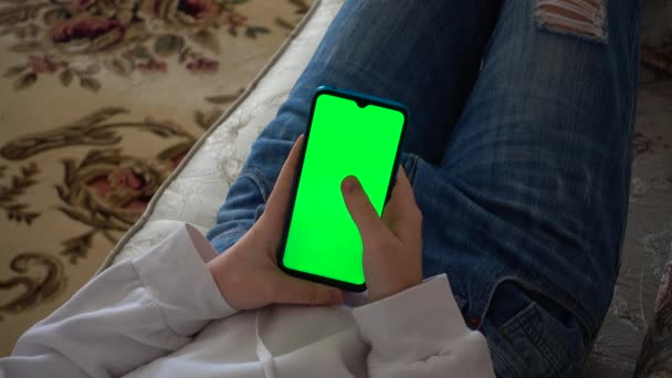 Teenager Looks Information Smartphone Screen Green Background — Stock Video