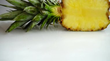 Falling juicy pieces of pineapple. Slow motion.