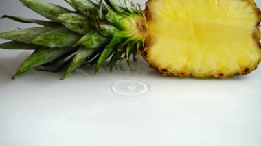 Falling juicy pieces of pineapple. Slow motion.