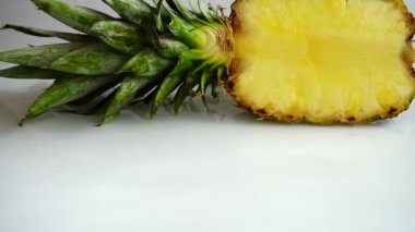 Falling juicy pieces of pineapple. Slow motion.