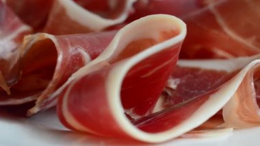 Jamon on the plate. Shooting in motion.