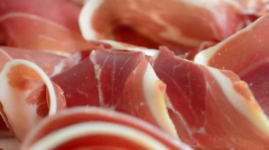 Jamon on the plate. Shooting in motion.
