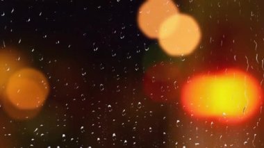 Yağmurda arabanın farları yanacak. Pencereden görüntüle.