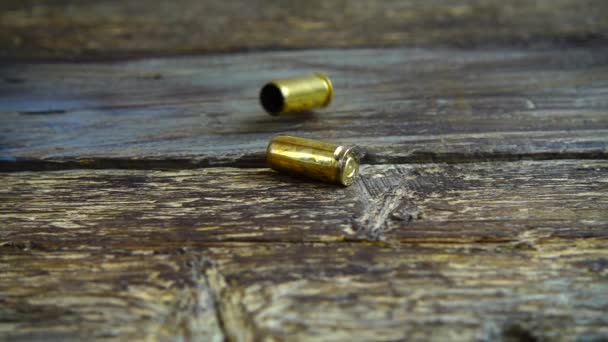 Bullet Casings 5Mm Pistol Falling Closeup Old Vintage Wooden Floor — Stock Video