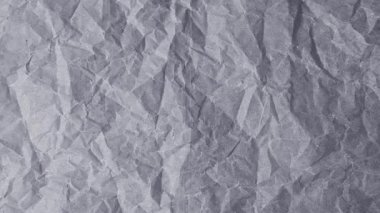 Gri ve kömürün tonlarında çeşitli buruşmuş eko geri dönüşümlü kağıtların hareket animasyonunu durdur. Dizide doğal renklendirme maddesi ve organik bitkisel boyalı el yapımı kağıdın dokulu bir yüzeyi gösteriliyor..
