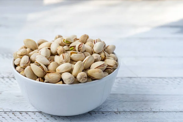 toasted pistachios in a bowl. Nuts vegan protein