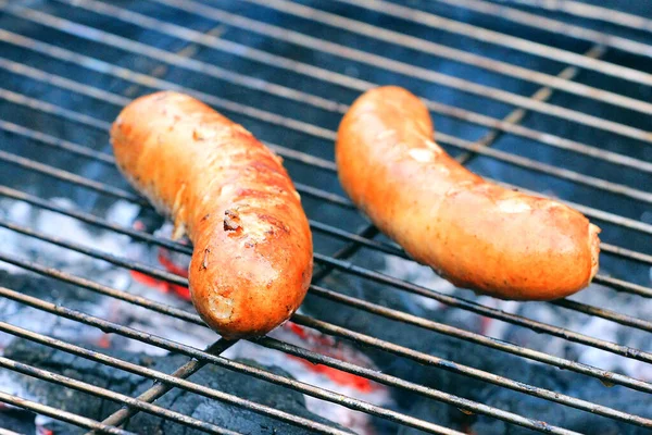 Roasted Appetizing Two Sausages Grilled Fire Beer Royalty Free Stock Photos