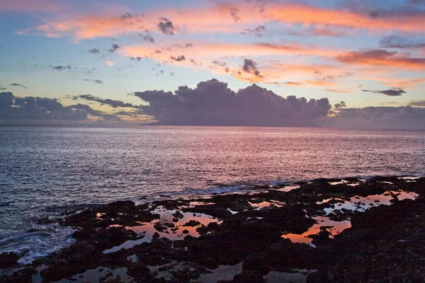 sunset on the shore of the Atlantic Ocean on the island of Tenerife, Caribbean island, Spain