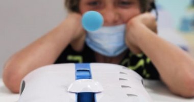 boy training thought concentration with blue ball during pandemic