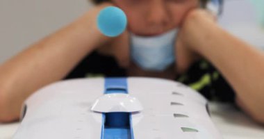 boy training thought concentration with blue ball during pandemic