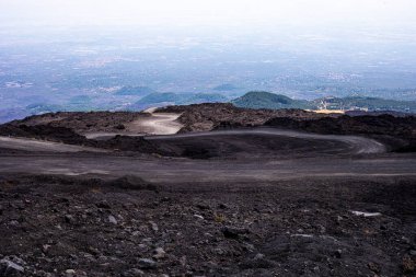 Beautiful scenery of Sicily and a road with the active volcano Etna during the day. Traveling in Italy