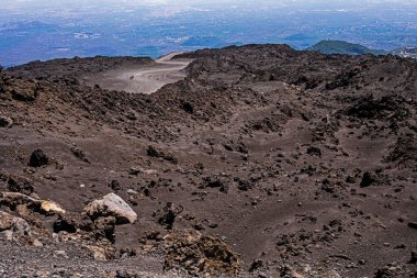 Beautiful scenery of Sicily and a road with the active volcano Etna during the day. Traveling in Italy