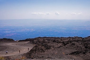 Beautiful scenery of Sicily and a road with the active volcano Etna during the day. Traveling in Italy