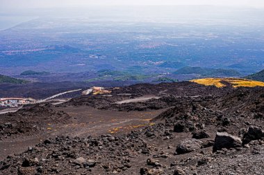 Road to the ascent and descent of Etna Volcano with a beautiful view of Sicily. Mountain tourism