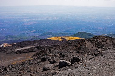 Road to the ascent and descent of Etna Volcano with a beautiful view of Sicily. Mountain tourism