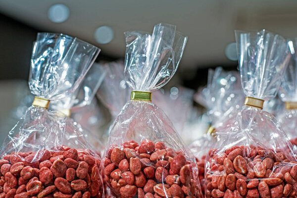 Chocolate-covered nuts wrapped in clear gift wrap